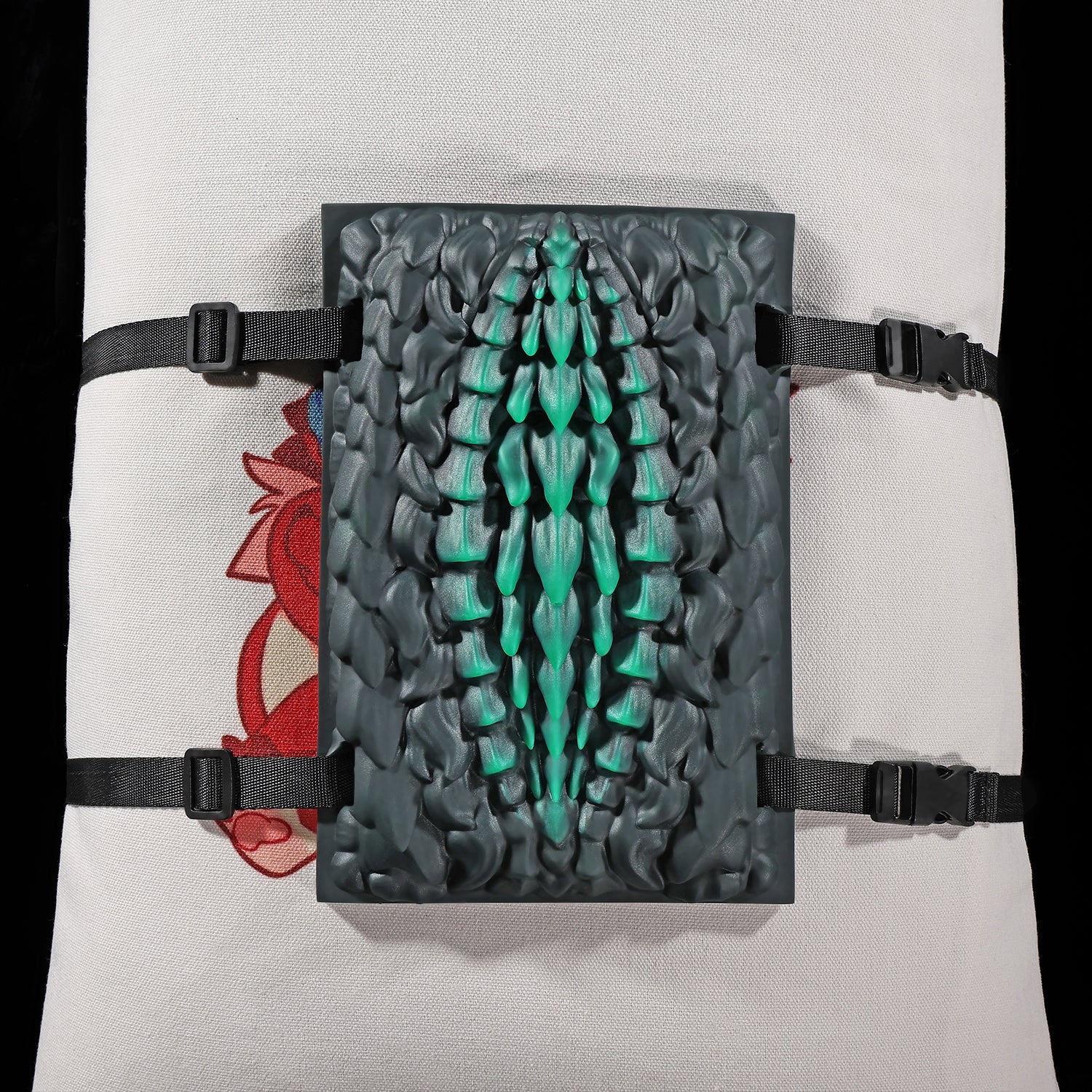 Meo's Scales dragon-scale fantasy grinder with adjustable harness straps - rear view with straps