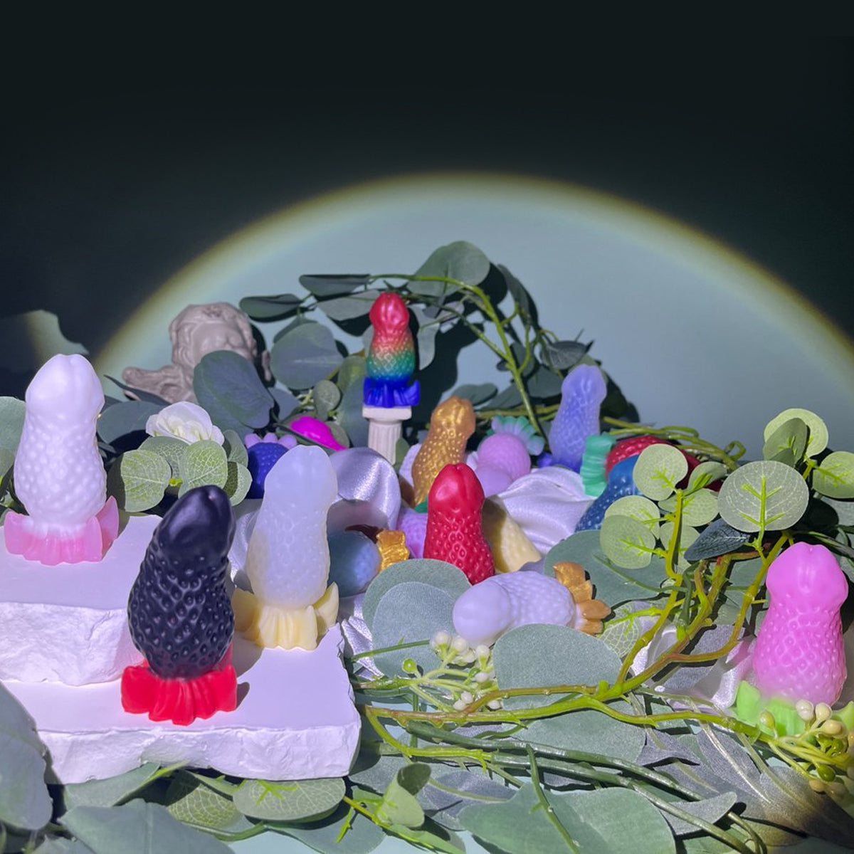 BERRYBLOOM fantasy strawberry butt plug with seed texture, leafy base, and rounded tip - custom color display