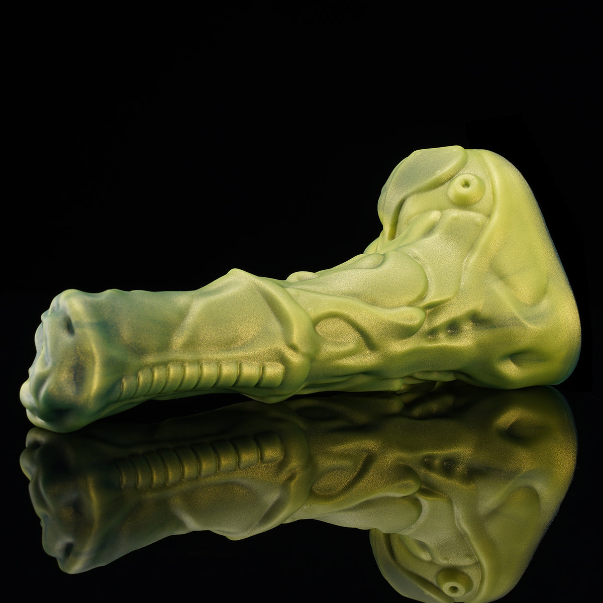 FIGURE fantasy horse dildo with a textured biomechanical shaft, sculpted head, and rounded balls - green angled view