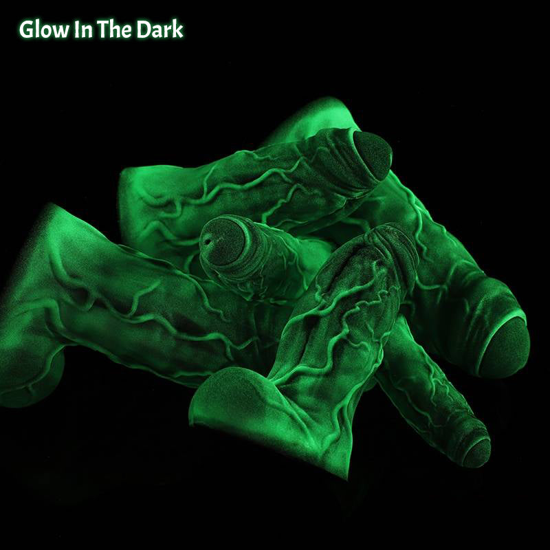 BANNER fantasy monster dildo with a thick muscular shaft, raised veins, rounded balls, and suction-cup base - glow-in-the-dark color view