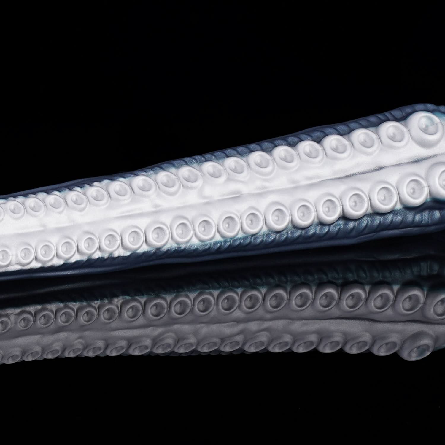 ABYSS II long tentacle dildo with a curved suction-cup texture and flared base - suction-cup texture close-up