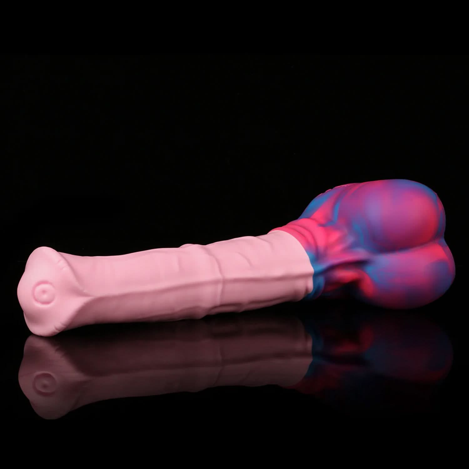AVOYO fantasy horse dildo with a tapered textured shaft, sculpted base, and rounded balls - pink and blue custom color angled view