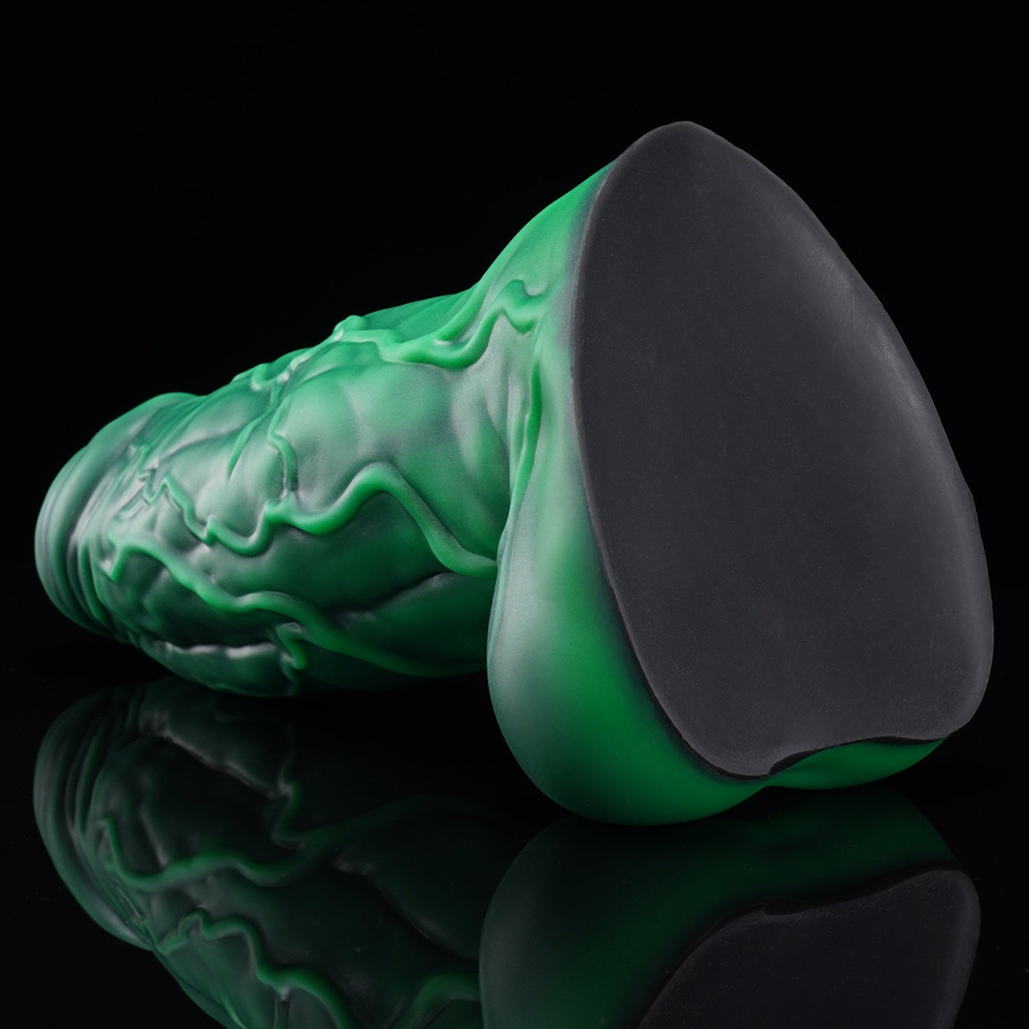 BANNER fantasy monster dildo with a thick muscular shaft, raised veins, rounded balls, and suction-cup base - green suction-cup base view
