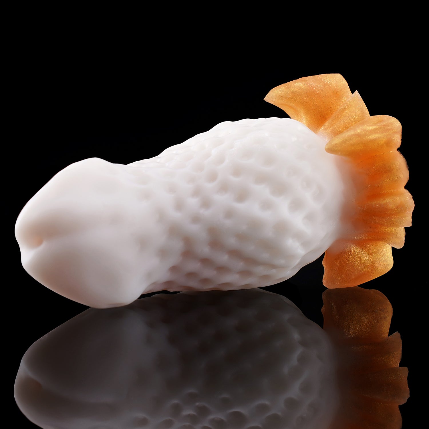 BERRYBLOOM fantasy strawberry butt plug with seed texture, leafy base, and rounded tip - white custom color angled view