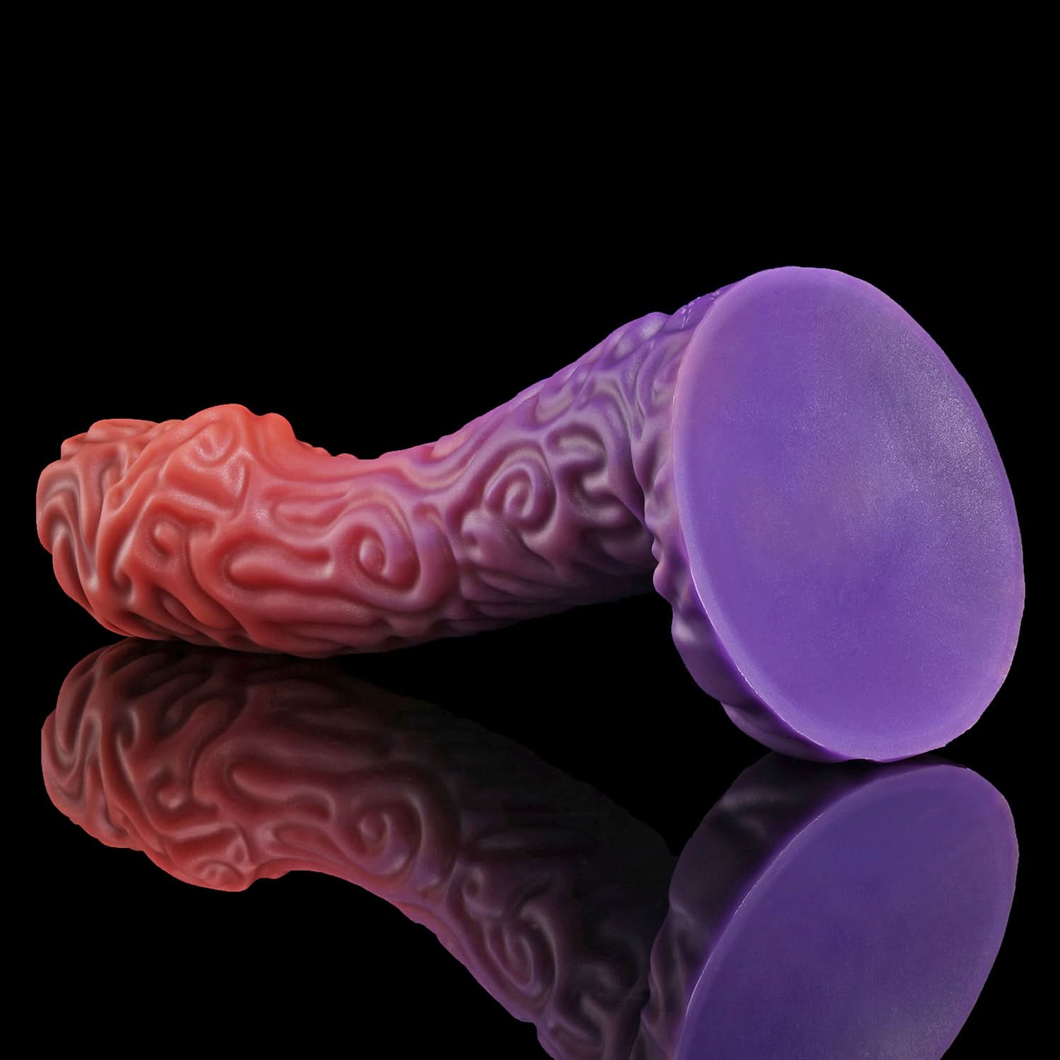 DEVIL FRUIT fantasy fruit dildo with raised spiral texture, a curved shaft, and flared suction-cup base - purple suction-cup base view