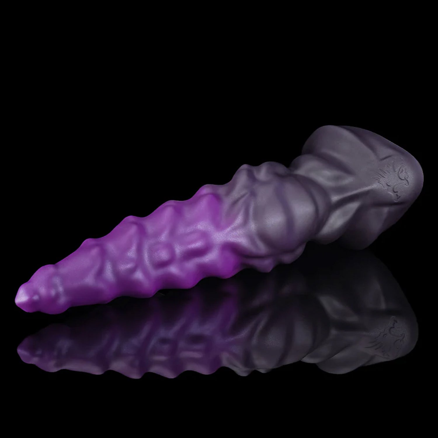 EIN fantasy unicorn dildo with a layered horn texture and wide suction-cup base - purple angled side view