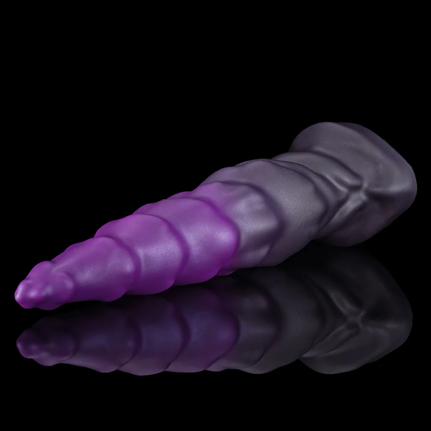 EIN fantasy unicorn dildo with a layered horn texture and wide suction-cup base - purple angled view