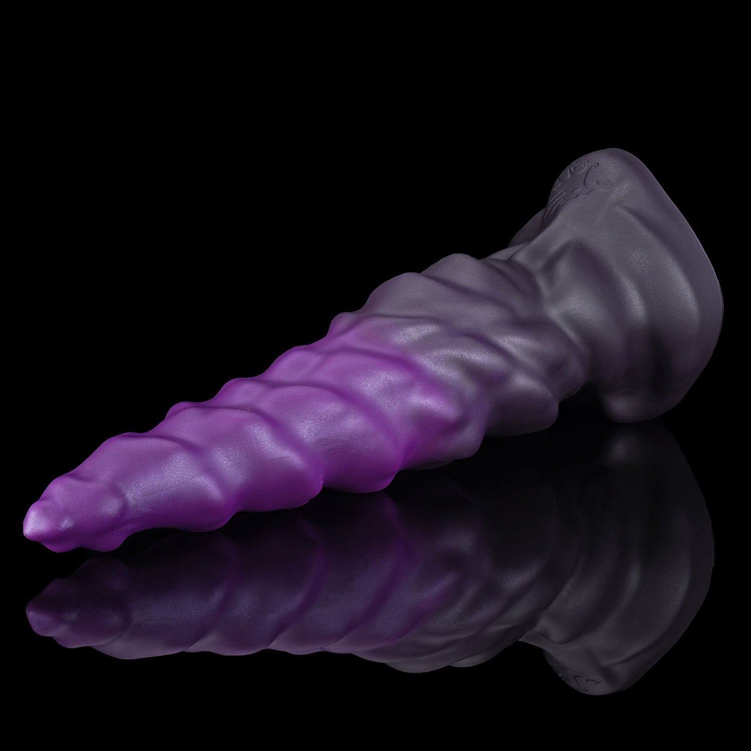 EIN fantasy unicorn dildo with a layered horn texture and wide suction-cup base - purple low side view