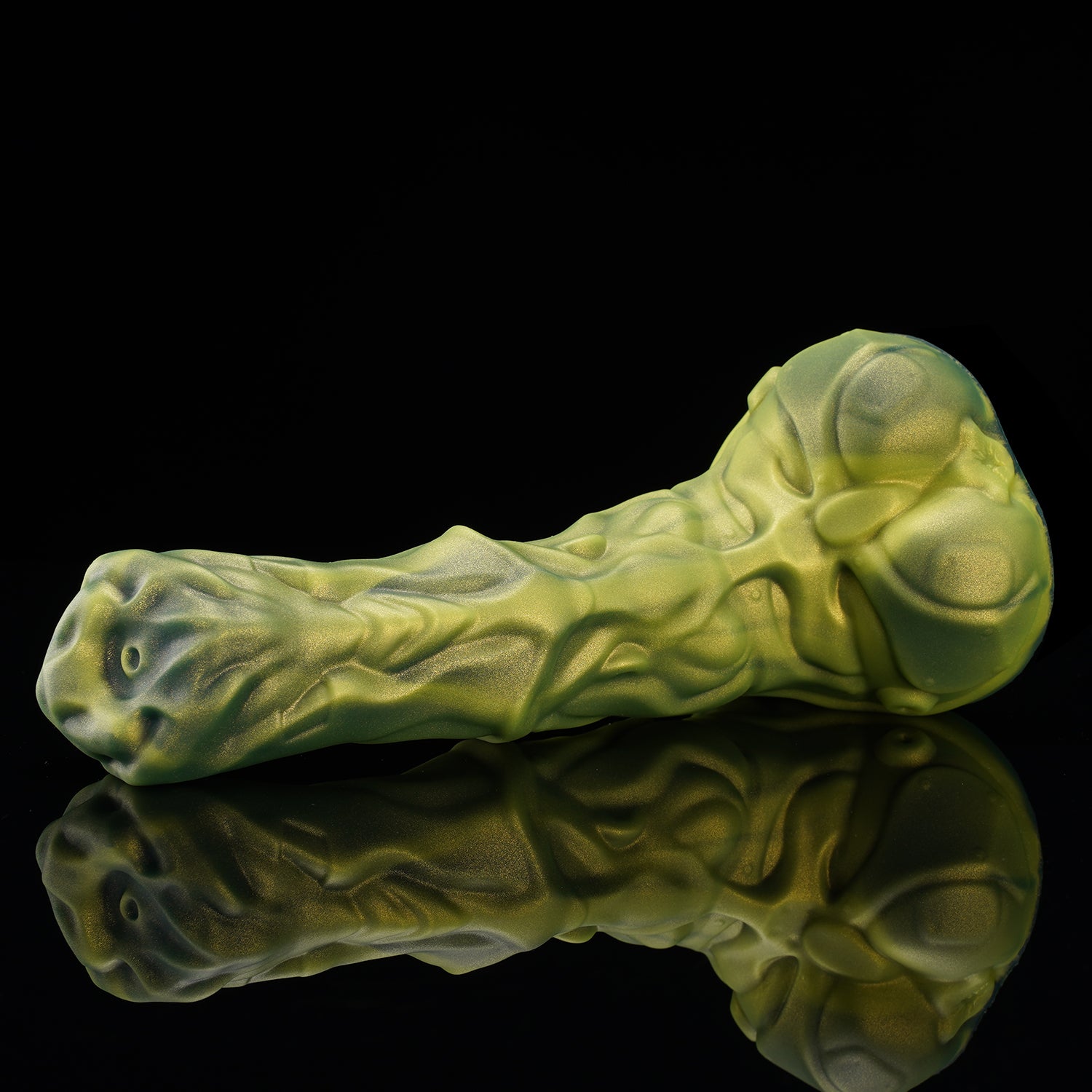 FIGURE fantasy horse dildo with a textured biomechanical shaft, sculpted head, and rounded balls - green low side view