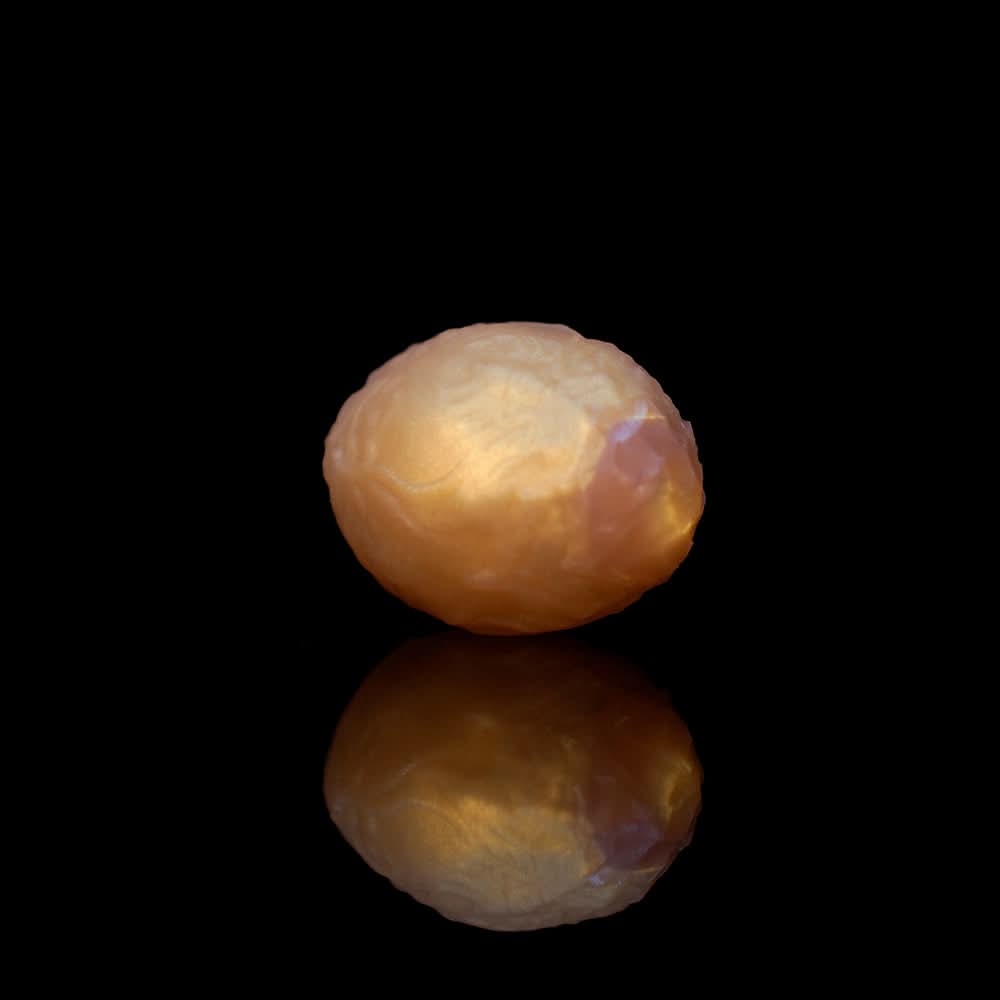 Set of seven graduated silicone alien eggs in metallic gold, silver, and bronze finishes.