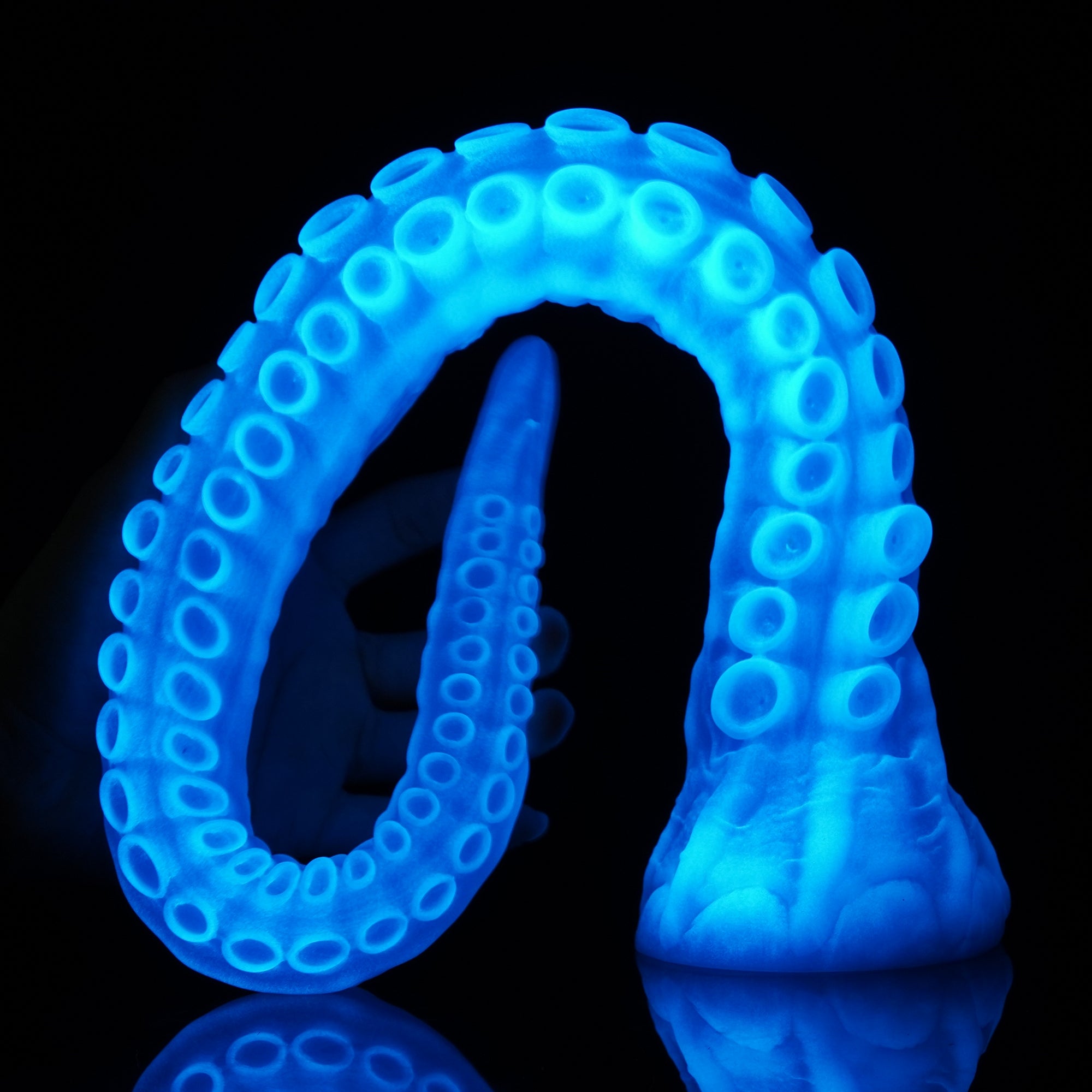 ALLA curved tentacle dildo with raised suction cups and sculpted flared base - blue custom color coiled view