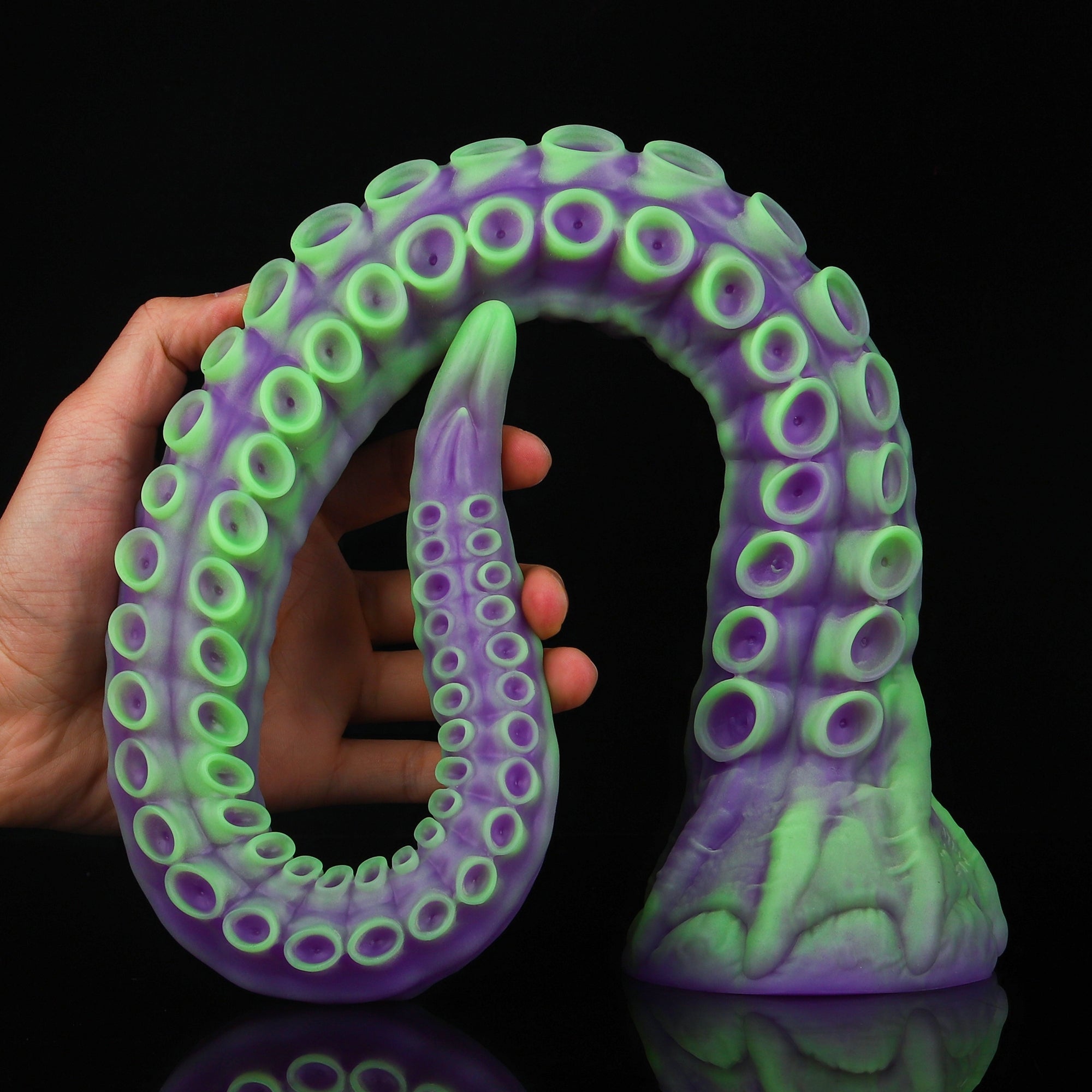 ALLA curved tentacle dildo with raised suction cups and sculpted flared base - green and purple custom color hand-held view