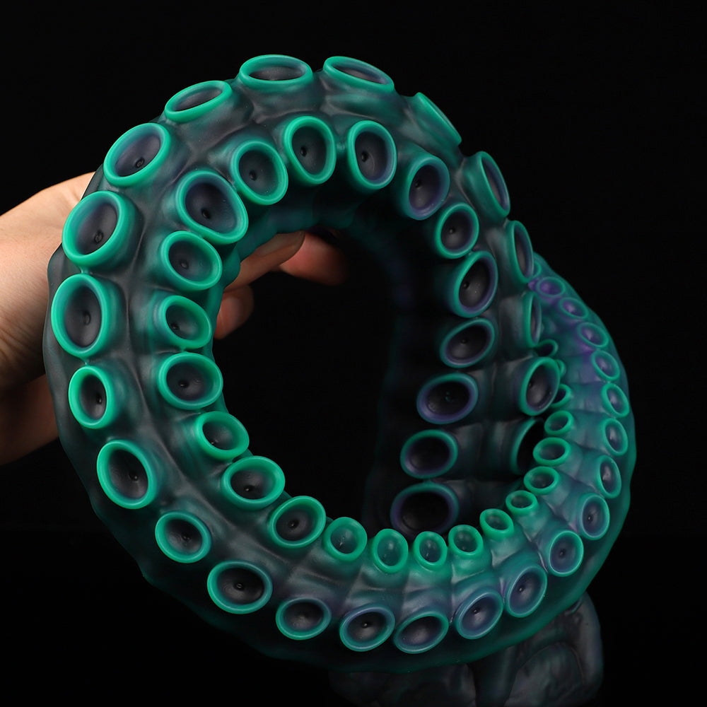 ALLA curved tentacle dildo with raised suction cups and sculpted flared base - green custom color coiled view