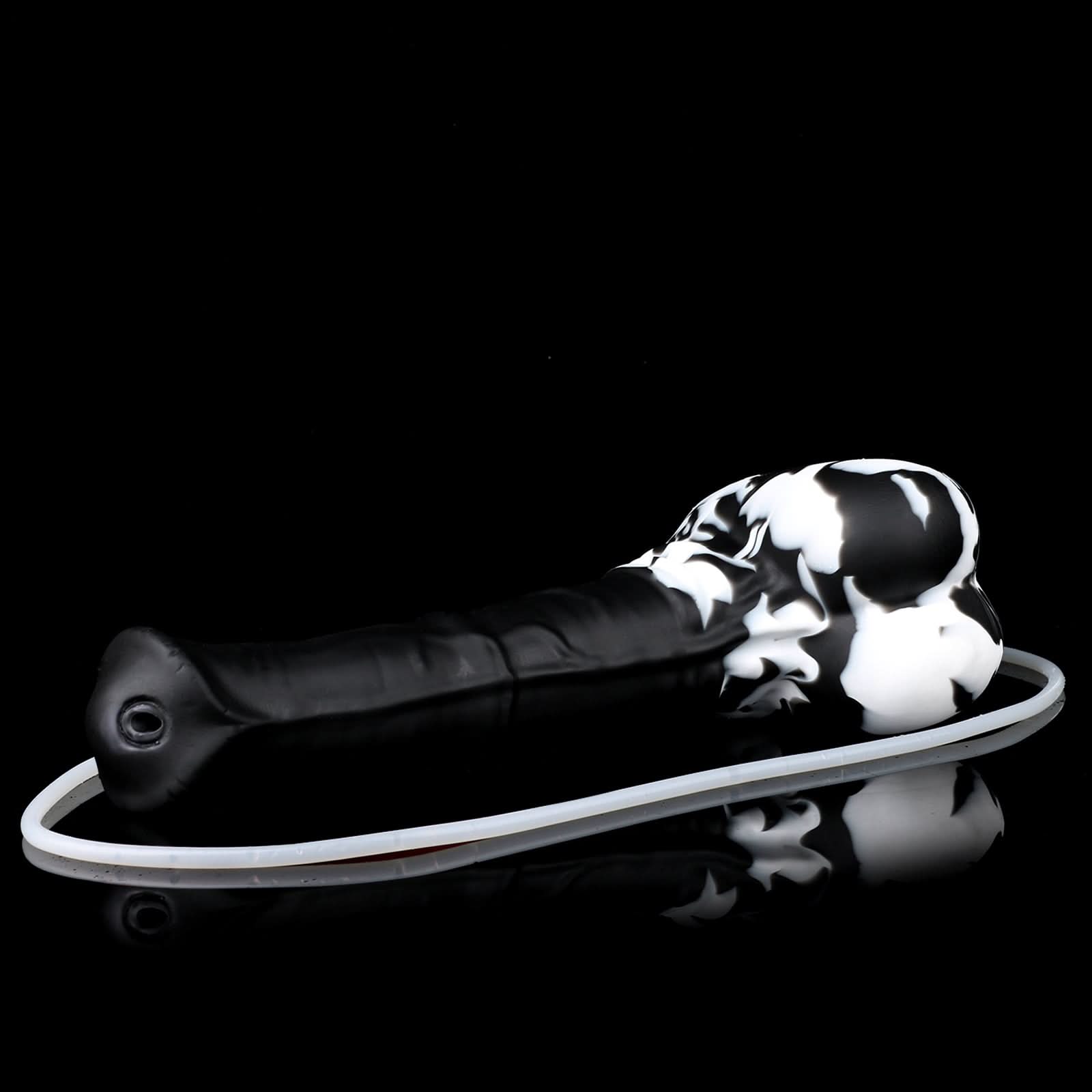 AVOYO plus tube fantasy horse ejaculating dildo with a tapered textured shaft, sculpted base, and built-in tube - black and white custom color low side view with tube